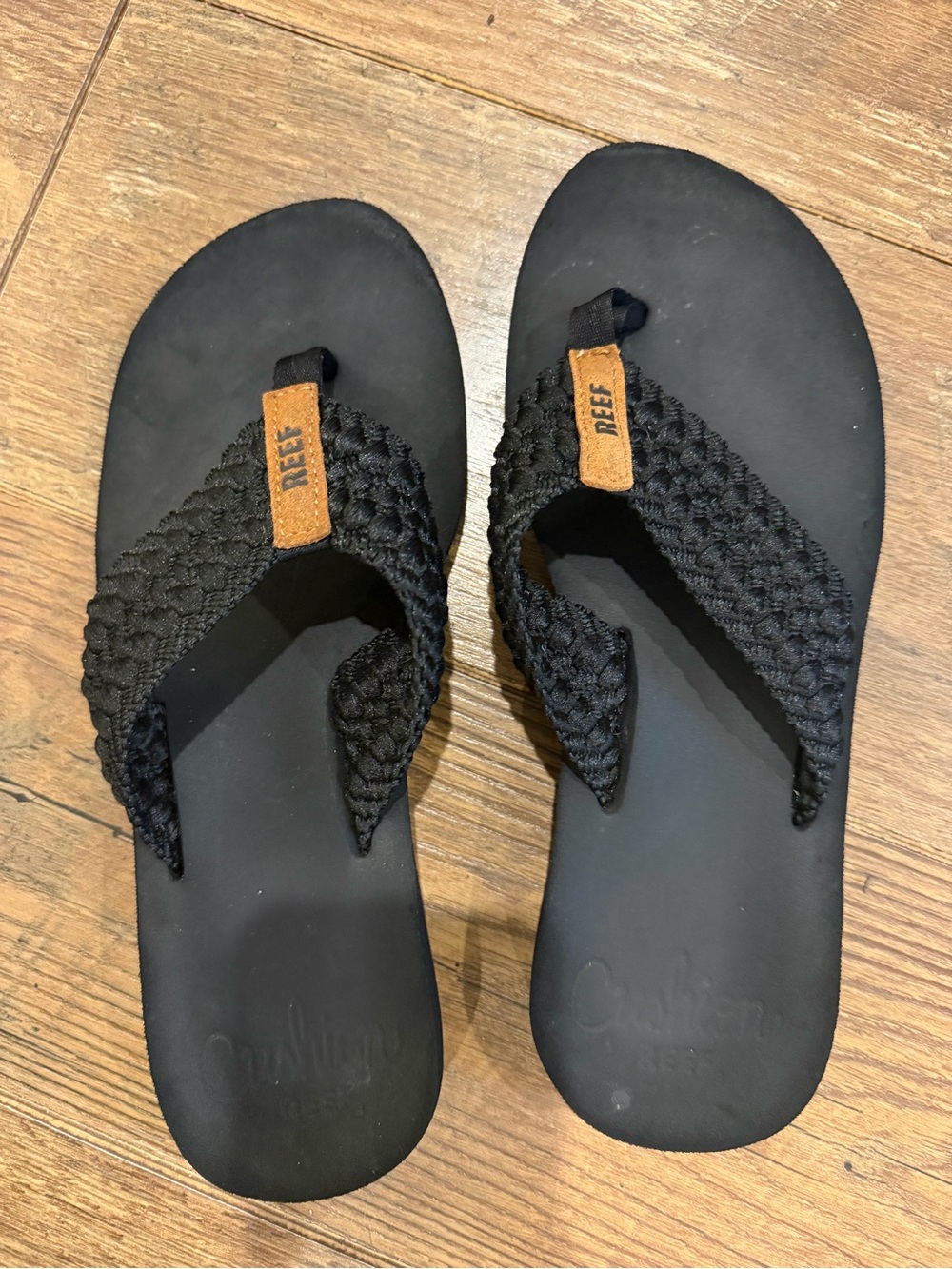 Reef Men's Black Braided Flip-Flops with Brown Logo Tab